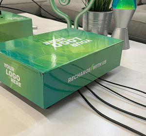Tabletop branded phone charging station on table surface