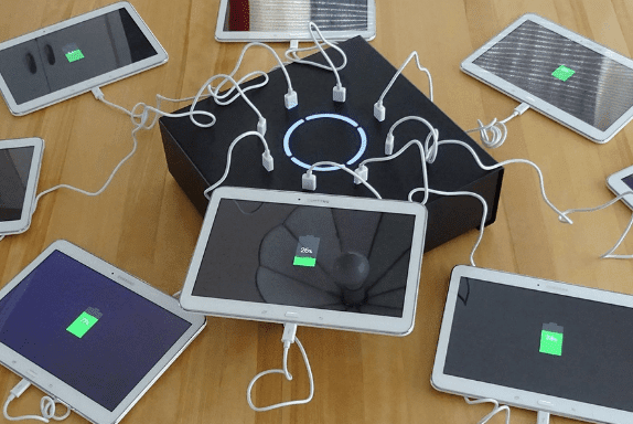 Black PowerBox tabletop charging station that is battery powered with tablets plugged in