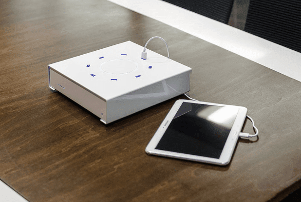 PowerBox tabletop charging kiosk USB powered on a dark wood table