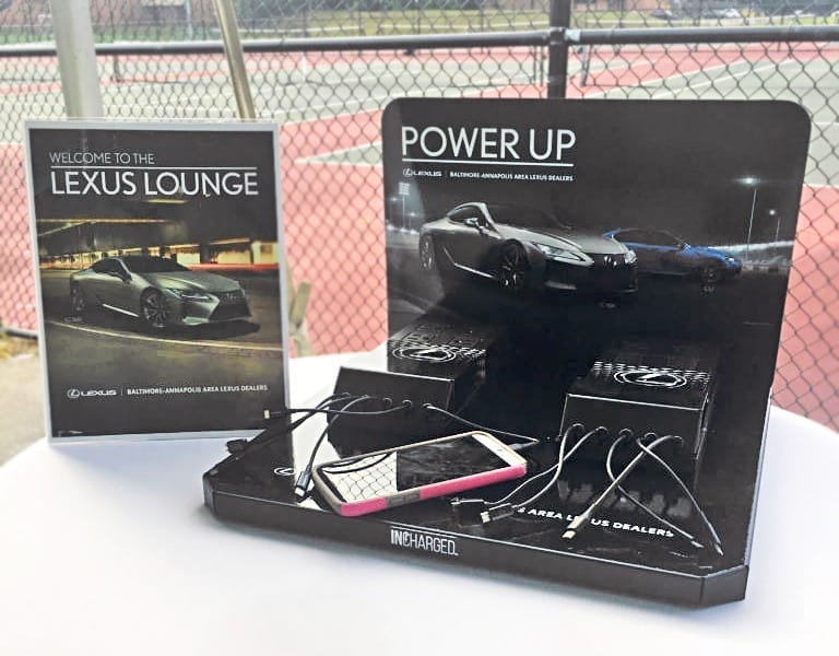 Lexus branded tabletop cell phone charging stations at outdoor event