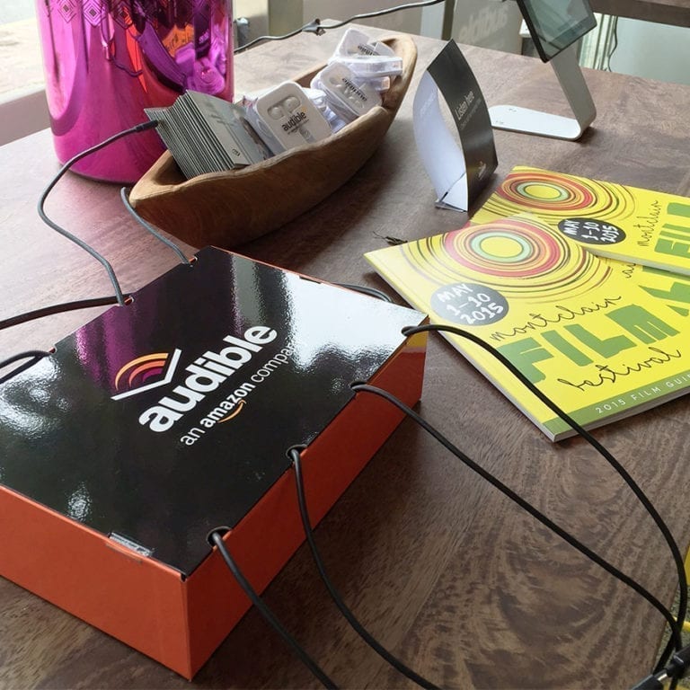 Audible branded tabletop cell phone charging station at event
