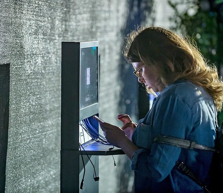 uber-charging-stations-video-screen-rental-coachella-woman
